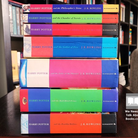 Seven books of the Harry Potter series stacked